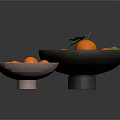 Fresh Tangerines in Two Bowls with Green Leaves on Dark Reflective Surface