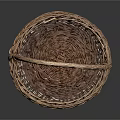 Sweet Little Kitten Resting Inside Brown Woven Basket On Black Background