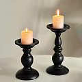 Decorative Ornament Set With Black Candle Holders And Lit Candles