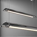 Modern Long Linear Pendant Lights with Sleek Metal Design Hanging in Minimal Space
