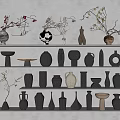 Ceramic Vessels in Various Shapes and Colors on White Shelves with Twig Decorations