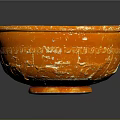 Artistic Orange Carved Bowl Sculpture With Textured Surface On Gray Background