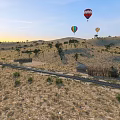 Sandy Desert Landscape With Colorful Hot Air Balloons Railroad Track Thatched Huts And Scattered Trees