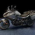 Silver Touring Motorcycle With Sleek Design Black Seat And Side Cases