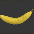 Ripe Yellow Banana With Brown Spots And Stem On Dark Background