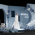 Wedding Stage Display With White Wedding Dress Model Blue Flowers And Lighting Decorations