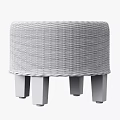 Rattan Sofa Stool With Dark Legs And Round Woven Design For Home Decor