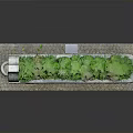 Stone Trough Planter With Green Plants On Brick Platform And Support Legs