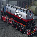 Red And Gray Heavy Truck With Tank Trailer At Industrial Site