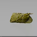 Traditional Chinese Zongzi Wrapped in Green Bamboo Leaves and Tied with String on Dark Glossy Surface