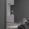 Gray Wall White Countertop Glass Display Cabinet With White Transparent Items And Stone Decoration