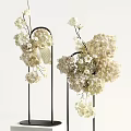 Elegant Modern White Flower Arrangements In Metal Stands And White Vases