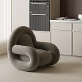 Modern Gray Curved Lounge Chair In Interior With White Blinds And Cabinets