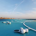 Modern Hotel Architecture Over Turquoise Water With White Curved Structures And Distant Cityscape