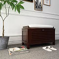 Wooden Storage Bench With White Cushion Green Plant Slippers And Magazines In Indoor Space