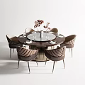 Elegant Round Dining Table With Quilted Leather Chairs Flower Vase And Wine Glasses