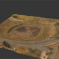 Aerial View Landscape With Circular Dirt Pit Surrounding Road Grassland And Small Buildings