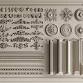 Ornate Carved Decorative Elements Including Circular Rosettes Columns And Linear Mouldings