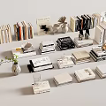 Stylish Modern Books and Magazines Display With Stacked Arrangement And Decorative Vase Plant Ornaments