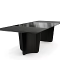 Modern Black Dining Table With Unique Leg Design And Sleek Smooth Surface