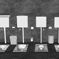 White Squat Toilets And Wash Basins In Public Restroom With Gray Wall And Trash Bins