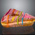 Glossy Triangular Donut With Pink Frosting And Colorful Stripes On Black Surface