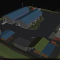Industrial Factory Complex Featuring Multiple Blue Roof Buildings Parking Area Trucks And Greenery