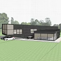 Modern Detached Villa With Black Facade Large Glass Windows And Grass Lawn