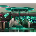 Stylish Fashion Clothing Store Interior With Green Lighting Clothing Displays And Decorative Backdrops