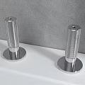 Modern Silver Faucet on White Countertop with Gray Wall Background and Small Spouts