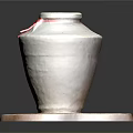 White Ceramic Jar With Red Ribbon On Irregular Wooden Base Against Dark Background