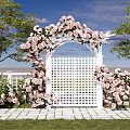 White Arch Entry Gate Decorated With Pink Roses Green Trees And Stone Pathway