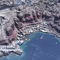 European style Architecture Village On Red Cliff With Blue Seaside And Boats