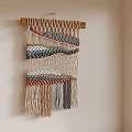 Decorative Handwoven Multicolored Macrame Wall Hanging With Tassels On Beige Wall