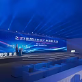 Bright Banquet Hall With Blue Backdrop Screen Podium Audience Seats And Lighting Effects For Conference