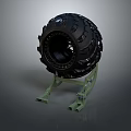 Black Rubber Tire Placed On Green Metal Stand Against Gray Background