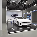 Car Dealership Showroom Showcasing White Car With Modern Lighting And Display Screen
