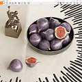 Ceramic Bowl Filled With Fresh Purple Figs On Light Tablecloth With Black Geometric Patterns