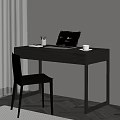 Black Desk Setup With Laptop Cup Pen Holder And Books Near Chair