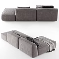 Modern Gray Sectional Sofa With Black Pillows And Draped Soft Blanket 3d model