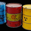 Rusted Industrial Metal Drums In Blue Red And Yellow With Shell And Radiation Symbols