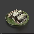 Delicious Chocolate Cakes With Cream And Red Filling Served On Green Plate