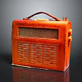 Vintage Orange Leather Portable Computer With Handle And Front Panel Controls 3d model