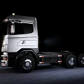 Sleek Scania Functional Heavy Duty Truck With Silver Chassis And Modern Roof Lights