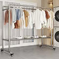 Stainless Steel Garment Rack With Hanging Clothes And Shoes Near Washing Machines