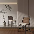 Modern Dining Chairs With Rattan Backrests Black Frames And Light Cushions Near Potted Plant