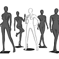 Black and white female mannequins in various standing poses for retail