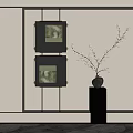 Stylish Interior With Black Framed Artworks And White Flowering Vase On Pedestal