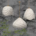 Textured White Wave Shaped Pendant Lights with Gold Hanging Chains on Grey Wall