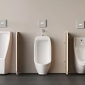Three Modern Wall Mounted White Ceramic Urinals In Public Restroom Interior Design